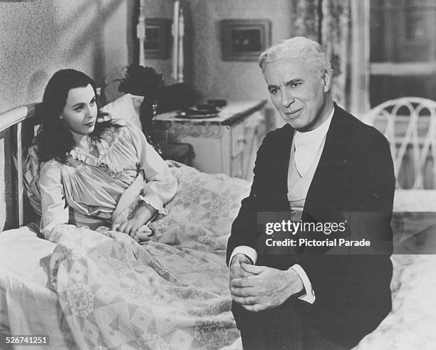 Film still of actors Charlie Chaplin and Claire Bloom in a bedroom scene, from the film 'Limelight', 1952.