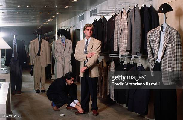 Man tries on a suit at the Emporio Armani in Italy.