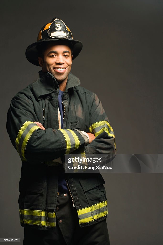 Fireman Smiling Fireman Smiling On Black Background Portrait High-Res Stock Photo ...
