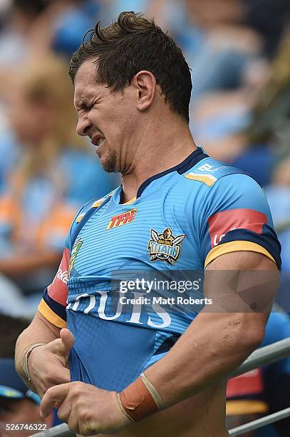 Greg Bird of the Titans grimaces during the round nine NRL match between the Gold Coast Titans and the Melbourne Storm on May 1, 2016 in Gold Coast,...