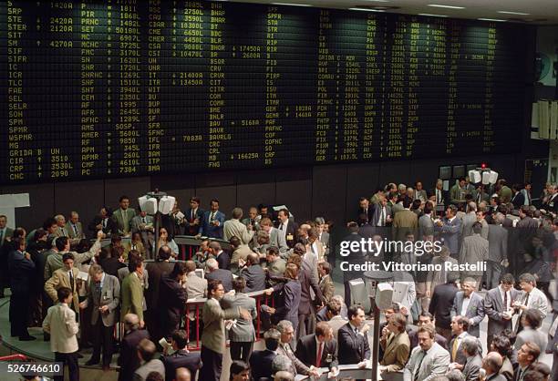 Frantic stock traders at the Milan stock exchange.