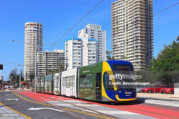 gold coast light rail (g:link) service with high-rise buildings - tram stock pictures, royalty-free photos & images