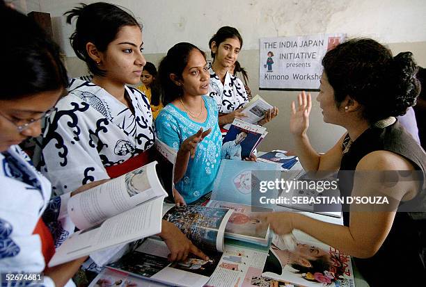 Indian college students draped in a summer cotton Kimono 'Yukata' speak with aJapanese lecturer during a 'Indian Japan Initiative' at the SNDT...