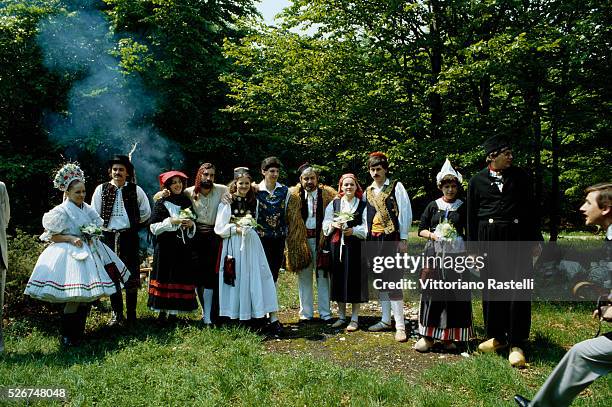 Group of Yugoslavian people wear traditional dress for a wedding . | Location: Plitvice, Yugoslavia.