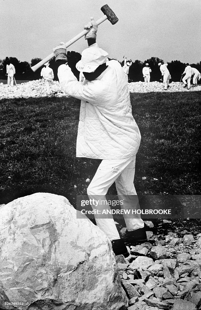 Prrisoner Breaking Rocks A prisoner on a chain gang at Limestone Correctional Facility breaks ...