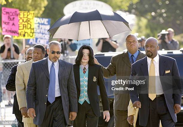 Michael Jackson arrives at the Santa Barbara County courthouse for his child molestation trial April 21, 2005 in Santa Maria California. Jackson is...