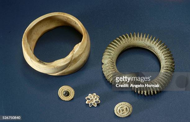 Conch and faience bangles and ear studs in steatite and faience from the Indus Valley settlement.