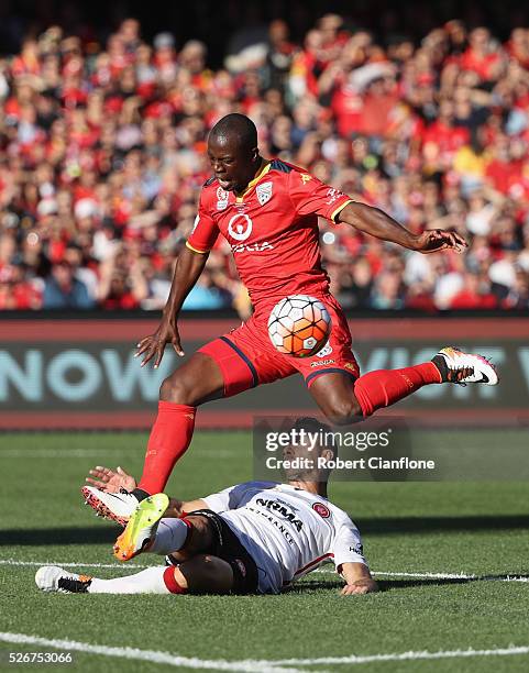 Bruce Djite of Adelaide United is challenged by Alberto of the Wanderers during the 2015/16 A-League Grand Final match between Adelaide United and...