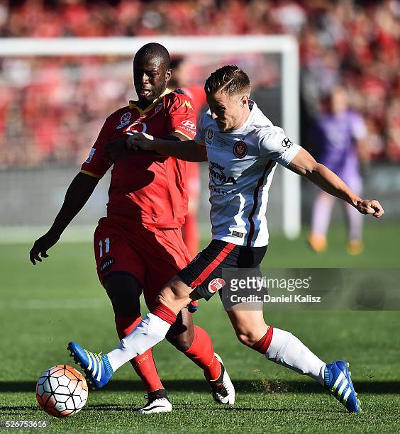 Bruce Djite of United and Scott Jamieson of the Wanderers compete for the ball during the 2015/16 A-League Grand Final match between Adelaide United...