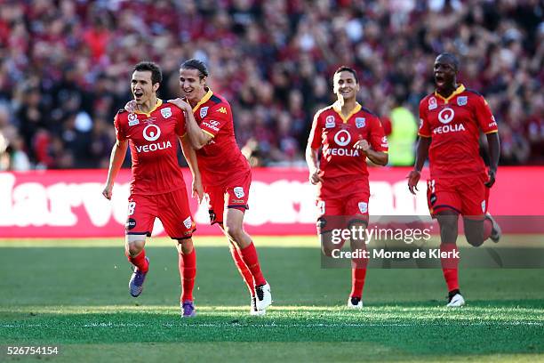 Isais of Adelaide United celebrate with teammates after scoring a goal during the 2015/16 A-League Grand Final match between Adelaide United and the...