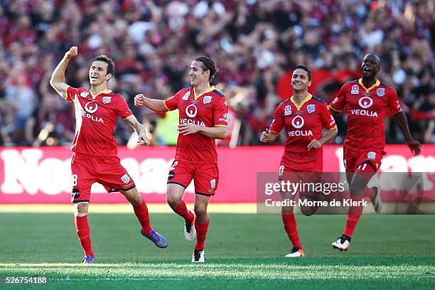 Isais of Adelaide United celebrate with teammates after scoring a goal during the 2015/16 A-League Grand Final match between Adelaide United and the...