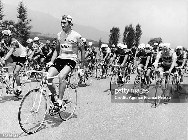 Belgian cyclist Eddy Merckx sits up on his cycle and takes it easy as he leads the pack during the eighth lap of the Tour de France, 1969. This would...