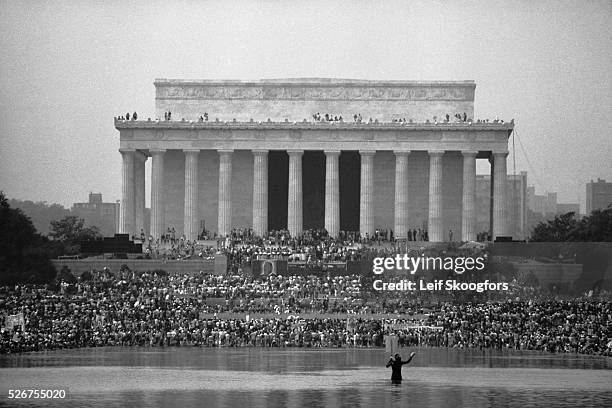 Variety of protesters participate in a demonstration in front of the Lincoln Memorial Building on the anniversary of Martin Luther King Jr.'s March...