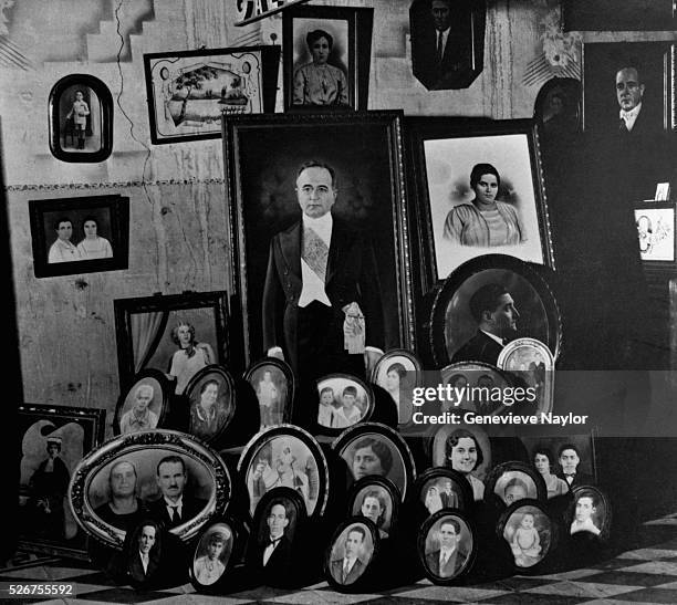 President Getulio Vargas, center, is pictured here, surrounded by other portraits of unknown people, in a photographic store during the Estato Novo.