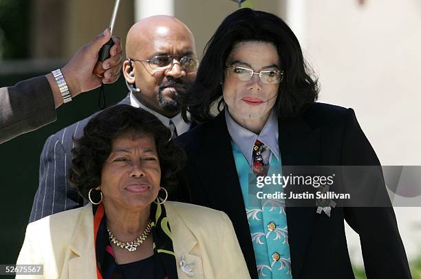 Michael Jackson leaves the Santa Barbara County Courthouse with his mother Katherine Jackson after another day of proceedings in his child...