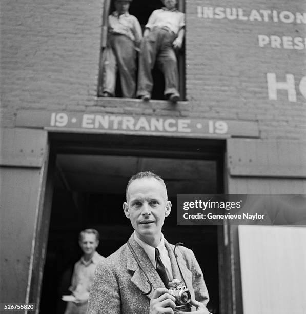 Henri Cartier-Bresson photographs the streets of Brooklyn outside a warehouse. His work in Brooklyn was chronicled in a photographic essay for...