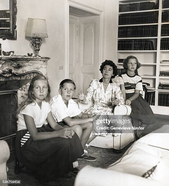 Queen Frederica of Greece sits with her children, Constantine, Irini, and Sophia. Constantine later ruled Greece as King from 1964 to 1974, and...