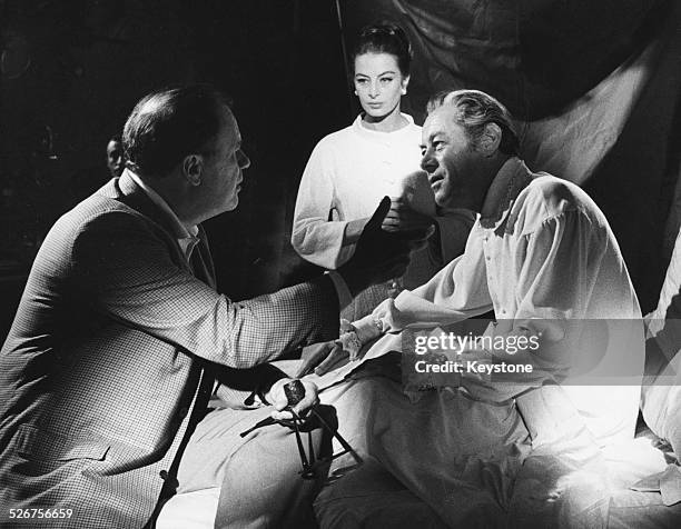 Director Joseph Mankiewicz talking to actors Capucine and Rex Harrison, on the set of the film 'The Tale of the Fox', or 'The Honey Pot', Rome,...