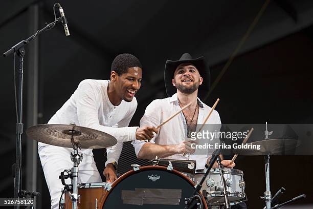 Jon Batiste and Joe Saylor perform at Fair Grounds Race Course on April 30, 2016 in New Orleans, Louisiana.