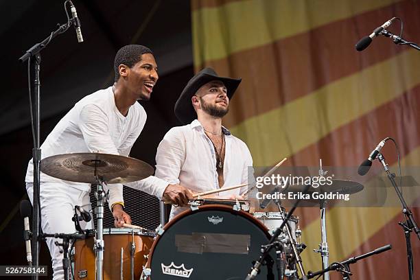 Jon Batiste and Joe Saylor perform at Fair Grounds Race Course on April 30, 2016 in New Orleans, Louisiana.