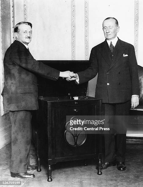 Portrait of inventors Guglielmo Marconi and Holless Wilbur Allen, presenting the radio-gramophone, at Marconi House, County Wexford, Ireland, 1930.