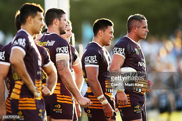 Corey Parker of the Broncos and team mates look dejected after a Sharks try during the round nine NRL match between the Cronulla Sharks and the...