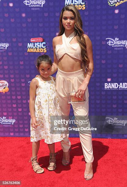 Actress Paris Berelc and sister arrive at the 2016 Radio Disney Music Awards at Microsoft Theater on April 30, 2016 in Los Angeles, California.