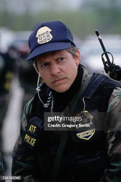 Atf Investigators An agent with the Bureau of Alcohol, Tobacco and Firearms stands ...