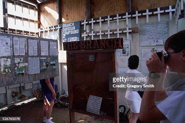 Visitors to the Branch Davidian's Mount Carmel compound near Waco, Texas, look at an exhibit on the deadly 1993 standoff. In February of 1993, the...