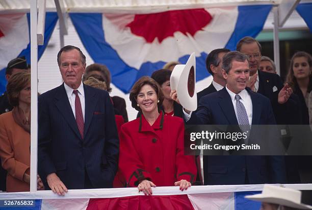 George W. Bush attends at his 1994 inauguration as governor of Texas with his wife, Laura, and his father, former president George Bush. Bush was...