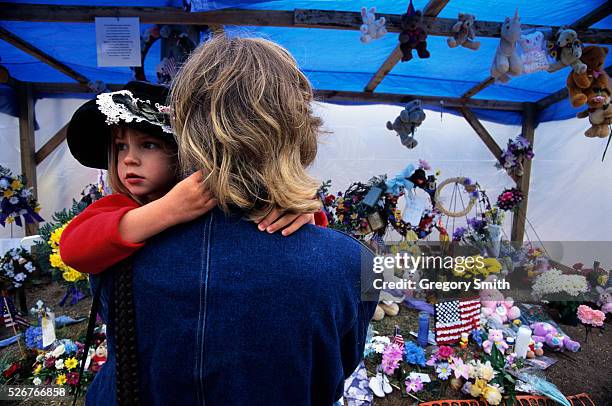 Young and old leave tributes to those who died in the bombing of the Alfred P. Murrah Federal Building.