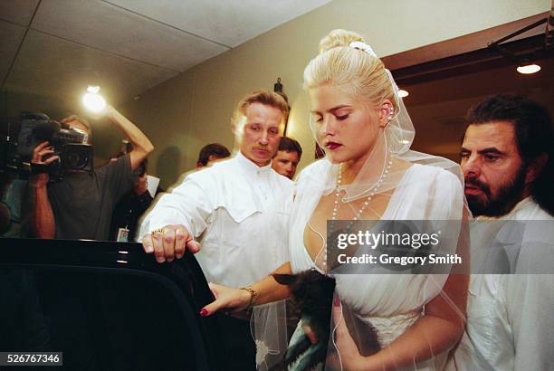 Anna Nicole Smith attends the memorial service for her husband J. Howard Marshall, who died at age 90. The memorial takes place on August 8 in...