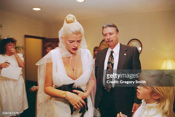 Anna Nicole Smith attends the memorial service for her husband J. Howard Marshall, who died at age 90. The memorial takes place on August 8 in...