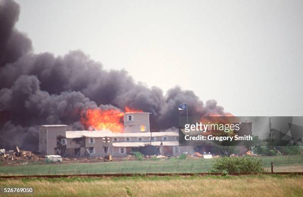 Smoking fire consumes the Branch Davidian Compound during the FBI assault to end the 51-day standoff with cult leader David Koresh and his followers....