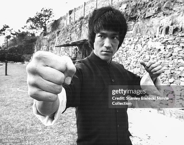 Actor and martial artist Bruce Lee rehearsing, on the set of the film 'Enter the Dragon', Hong Kong, circa 1973.