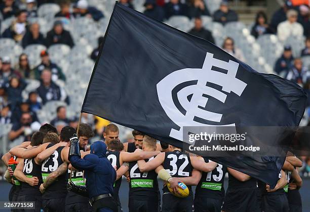 Blues players huddle during the round six AFL match between the Carlton Blues and the Essendon Bombers at Melbourne Cricket Ground on May 1, 2016 in...