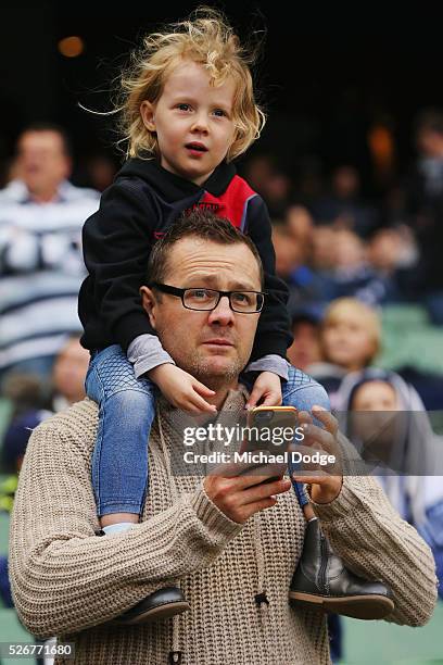 Bombers fan looks on during the round six AFL match between the Carlton Blues and the Essendon Bombers at Melbourne Cricket Ground on May 1, 2016 in...