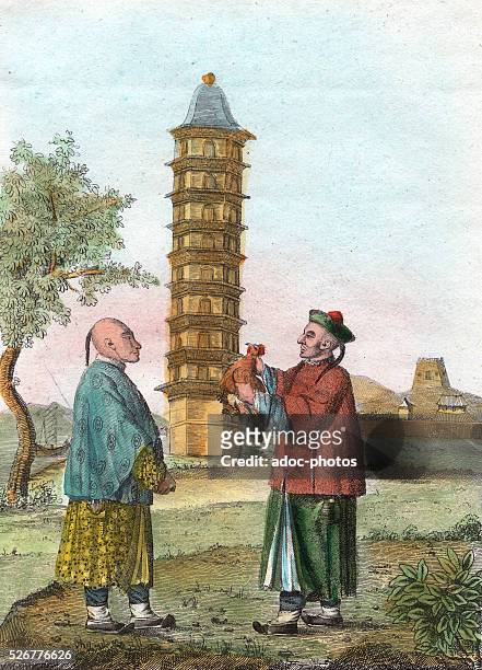 Coloured engraving depicting two Chinese men in traditional dress devoting an oath by the sacrifice of a rooster, China, circa 1800. Image dates from...