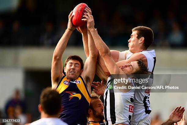 Jeremy McGovern of the Eagles takes a contested mark against Mason Cox of the Magpies during the 2016 AFL Round 06 match between the West Coast...