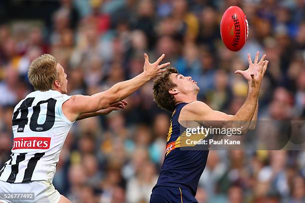 Jamie Cripps of the Eagles marks the ball against Josh Smith of the Magpies during the round six AFL match between the West Coast Eagles and the...