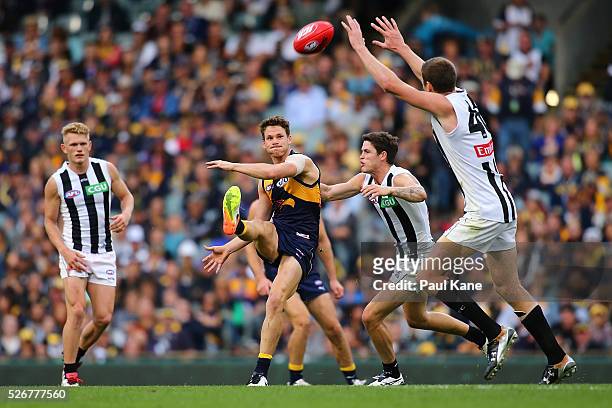 Jack Redden of the Eagles kicks the ball forward during the round six AFL match between the West Coast Eagles and the Collingwood Magpies at Domain...