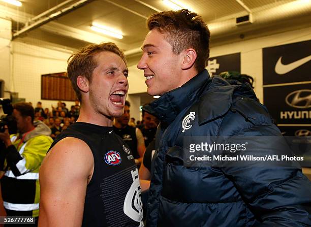 Ciaran Byrne and Patrick Cripps of the Blues celebrate during the 2016 AFL Round 06 match between the Carlton Blues and the Essendon Bombers at the...