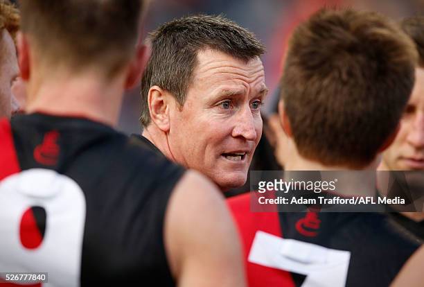 John Worsfold, Senior Coach of the Bombers addresses his players during the 2016 AFL Round 06 match between the Carlton Blues and the Essendon...