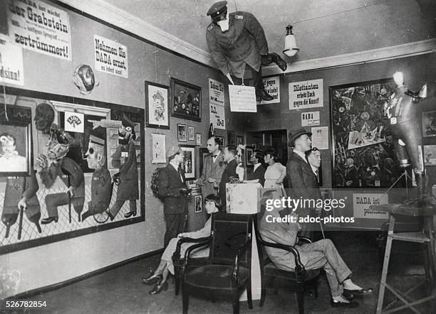 Opening of the 1st International Dada fair in the bookshop of the Dr. Burchard in Berlin . Standing from left to right: Raoul Hausmann, Otto...