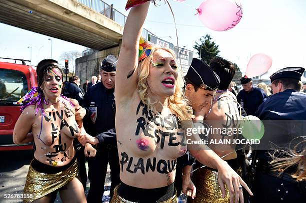 Inna Shevchenko and other topless Femen activists protest outside a banquet held by France's far-right Front National party in honour of Jeanne d'Arc...