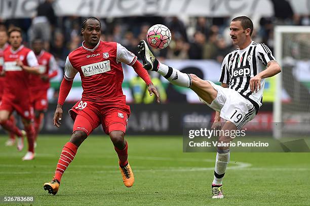 Leonardo Bonucci of Juventus FC controls the ball against Jerry Uche Mbakogu of Carpi FC during the Serie A match between Juventus FC and Carpi FC at...