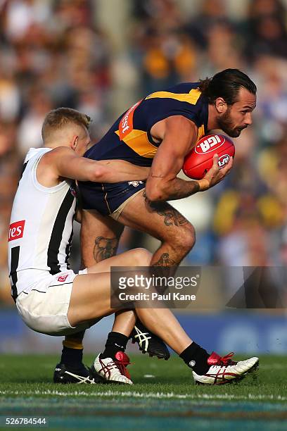Adam Treloar of the Magpies tackles Chris Masten of the Eagles during the round six AFL match between the West Coast Eagles and the Collingwood...