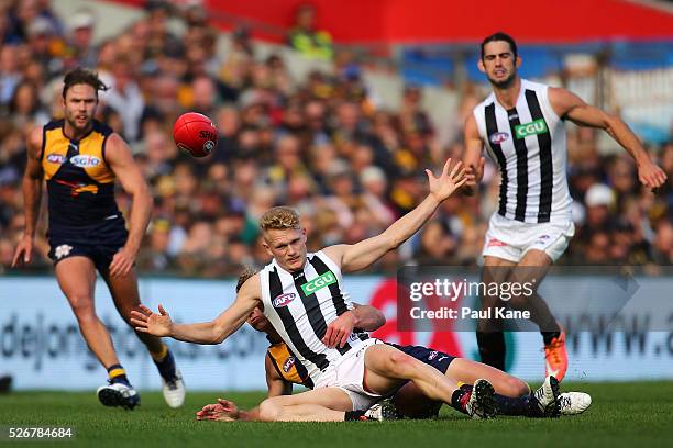 Adam Treloar of the Magpies gets tackled by Matt Priddis of the Eagles during the round six AFL match between the West Coast Eagles and the...