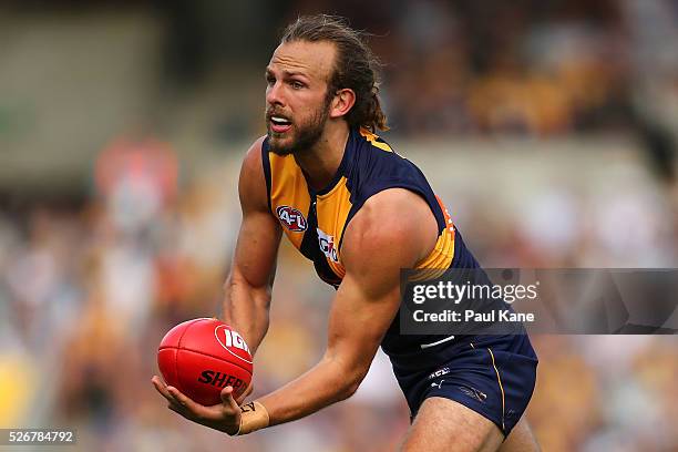 Will Schofield of the Eagles handballs during the round six AFL match between the West Coast Eagles and the Collingwood Magpies at Domain Stadium on...