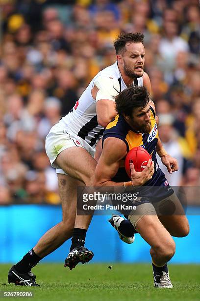Josh Kennedy of the Eagles marks the ball against Nathan Brown of the Magpies during the round six AFL match between the West Coast Eagles and the...